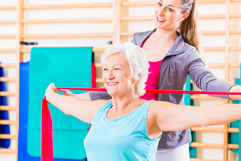 woman with bulging disc uses exercise bands