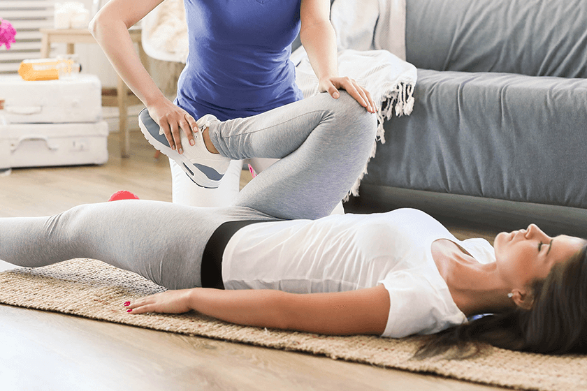 woman completes sciatica stretches