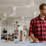 man with degenerative disc disease at standing desk