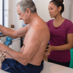 patient with lumbar herniated disc meets with physical therapist
