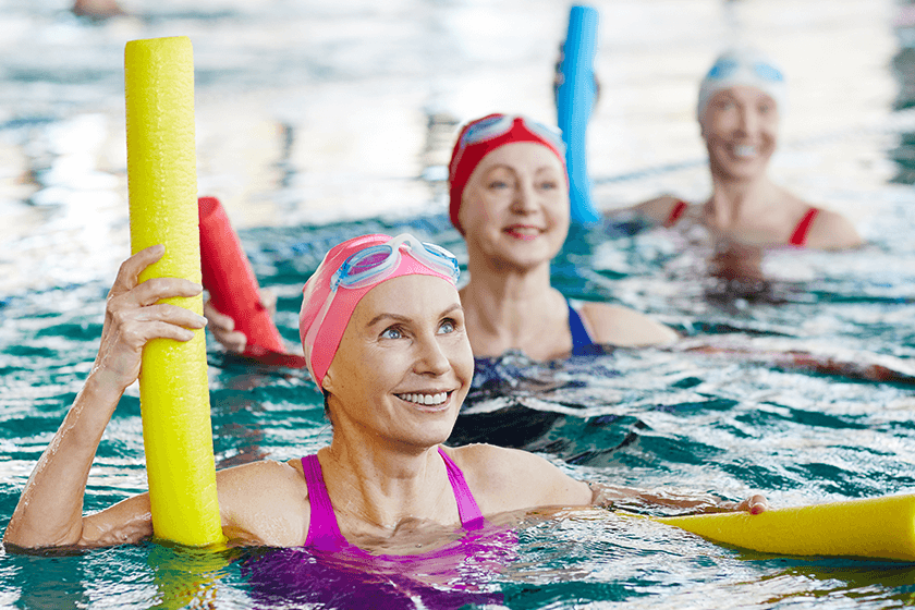 woman in water aerobics class for arthritis pain