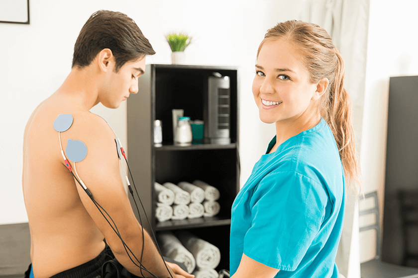man receiving electrotherapy for muscle pain