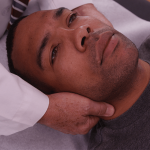 man with cervical bone spurs at doctor