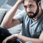 man with chronic back pain and depression