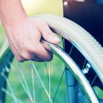 man in wheelchair with spinal cord injury