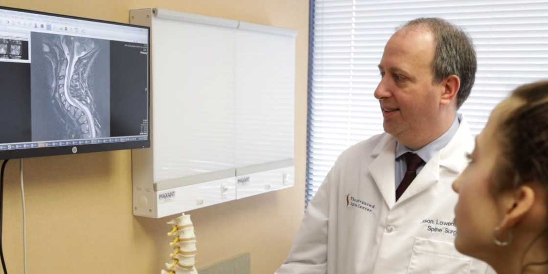 dr lowenstein giving scoliosis lecture to patient