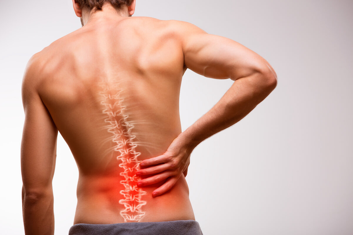 How do we treat low back strains and sprains with manual therapy?