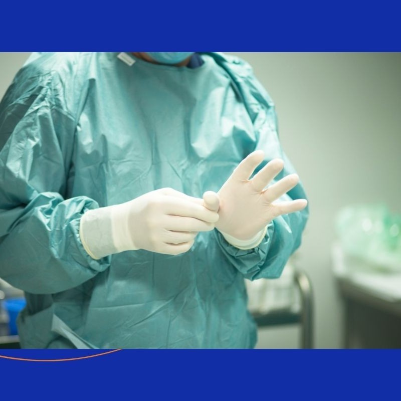 Healthcare professional putting on surgical gloves, representing care at The Advanced Spine Center in New Jersey.