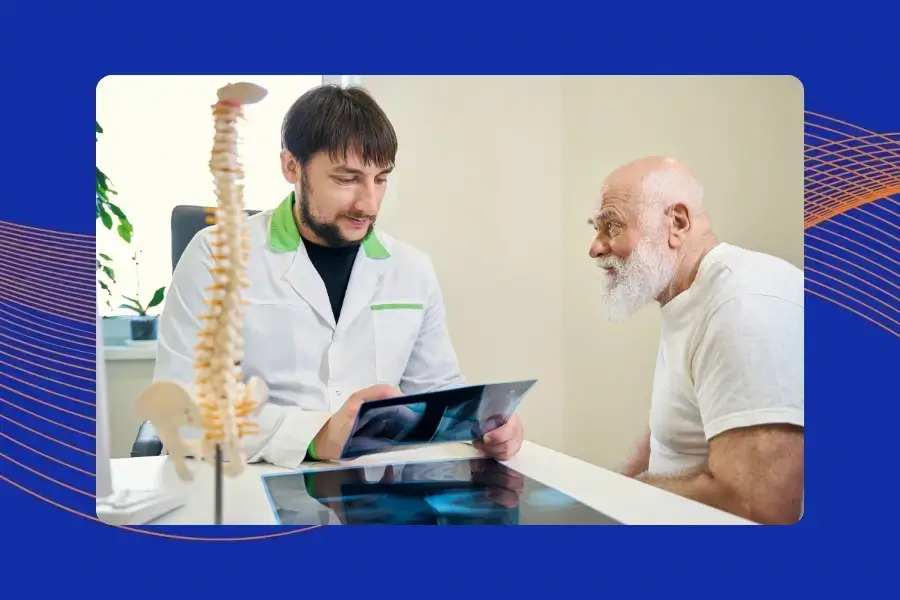 Patient reviewing artificial disc replacement treatment options with a spine specialist.