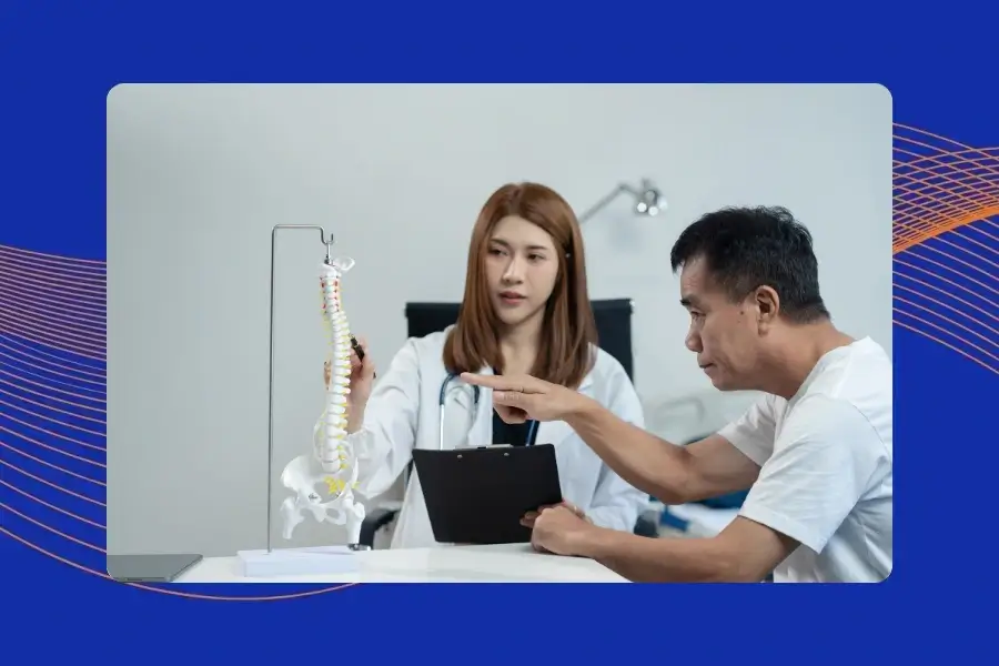 Spine specialist explaining microdiscectomy success rates and long-term outcomes to a patient.